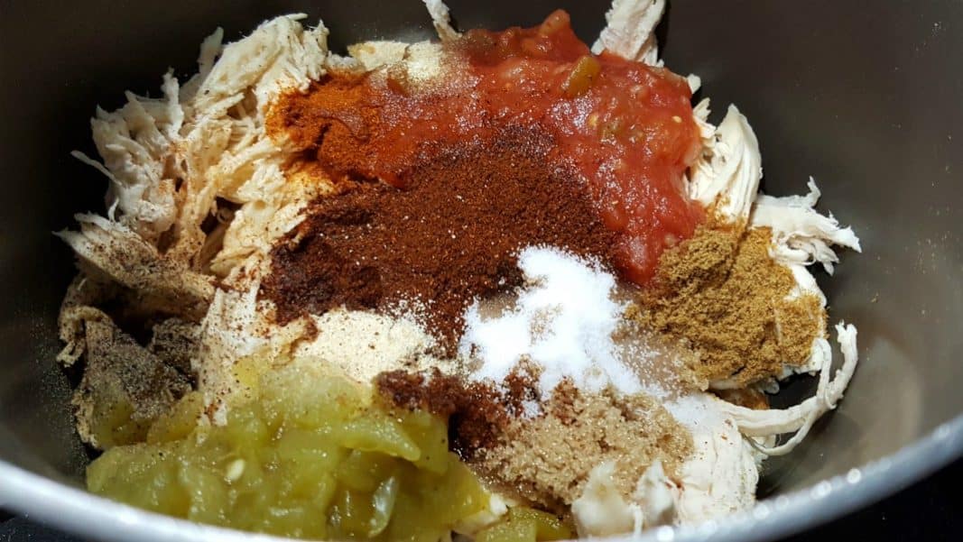 shredded chicken, salsa, brown sugar, spices, and liquid smoke in a sauce pan