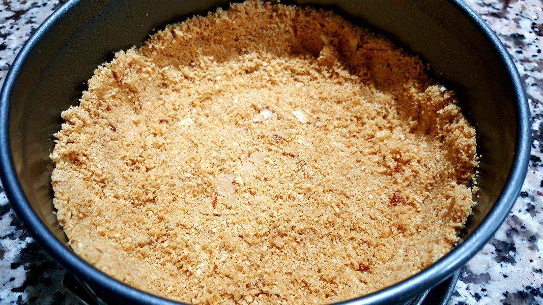 graham crumb crust in the bottom of a springform pan