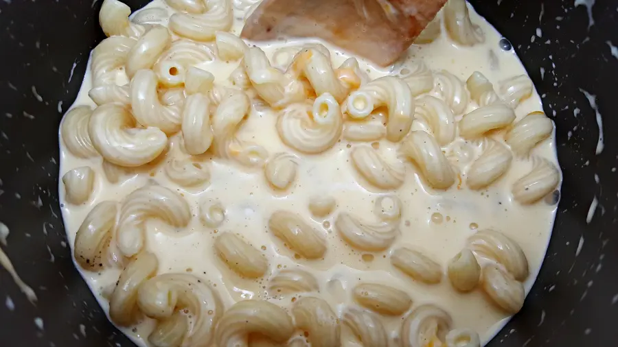 cooked cavatappi macaroni mixed with the cream and cheeses