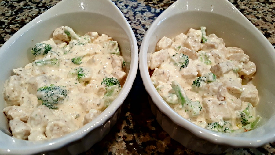 chicken broccoli casserole poured into two oven safe dishes.