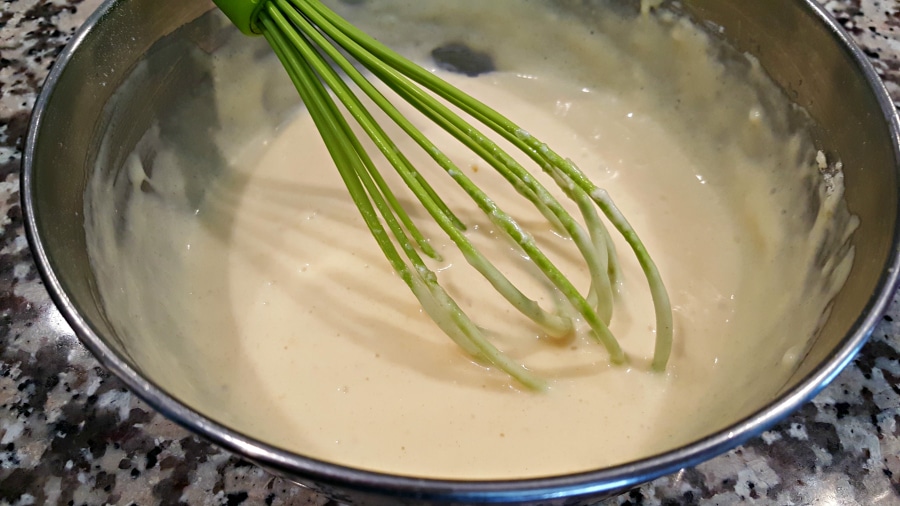 pancake batter in a bowl with a whisk.