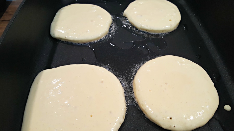 frying pancakes in skillet.