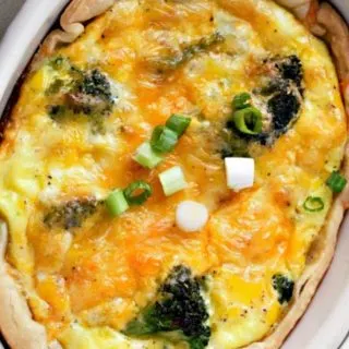 a casserole dish filled with Broccoli Cheese Quiche.