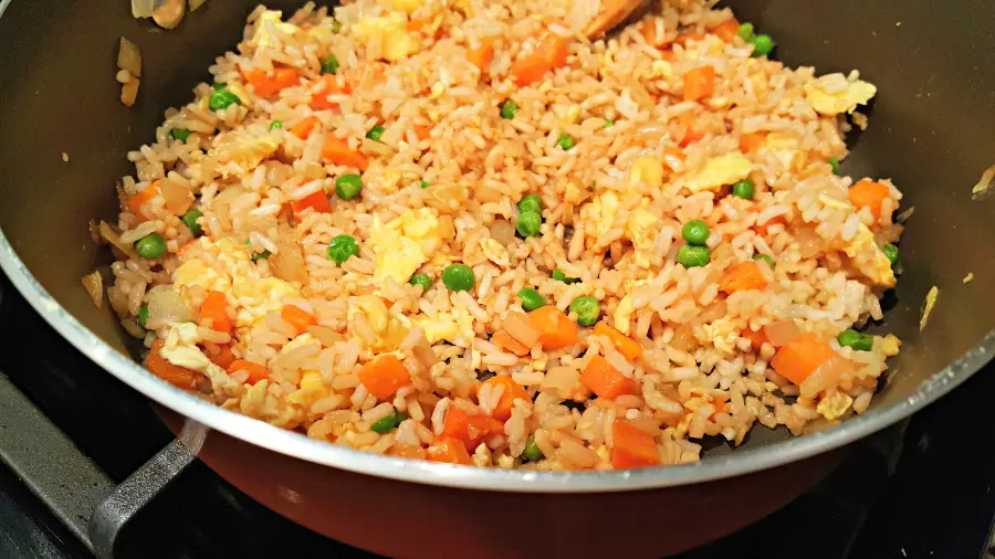 homemade fried rice cooking in a pan
