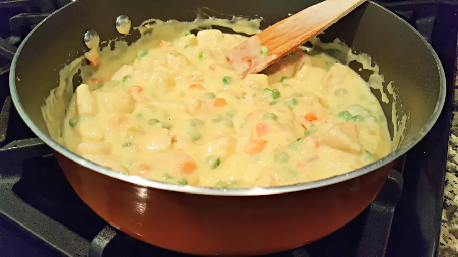 Chicken Pot Pie filling cooking in a pan.