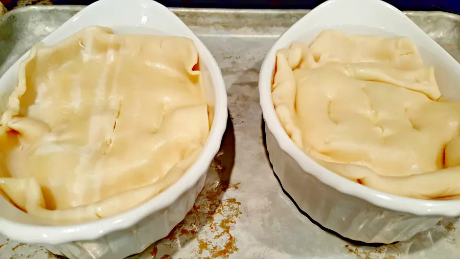 Individual Chicken Pot Pies topped with pie crust.