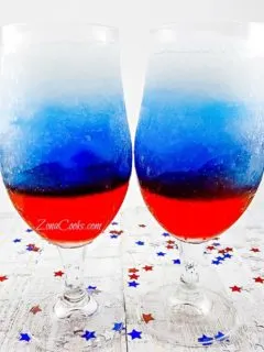 Red, White and Blue Rum Slush in two tall glasses.