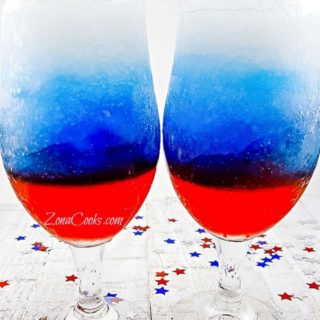 Red, White and Blue Rum Slush in two tall glasses.