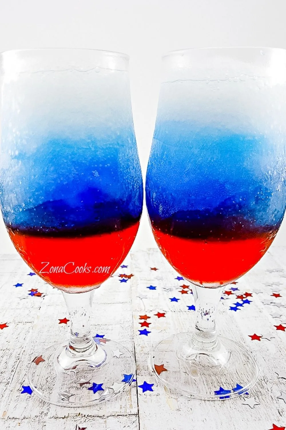 Red, White and Blue Rum Slush in two tall glasses.