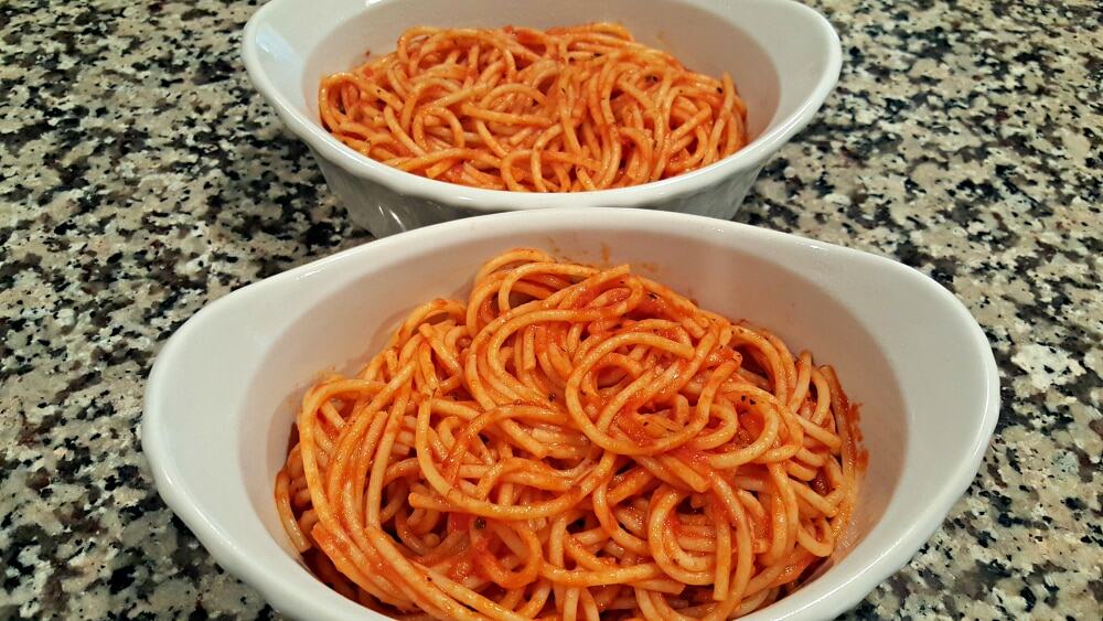 spaghetti with sauce in 2 dishes