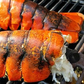 Lobster Tails cooking on a grill.