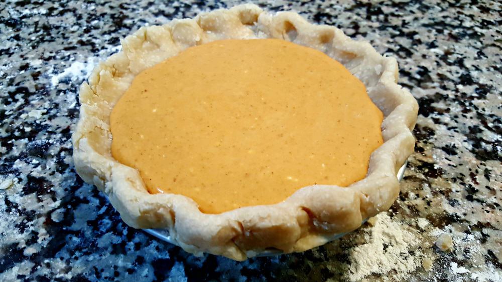 pumpkin pie filling poured into crust.