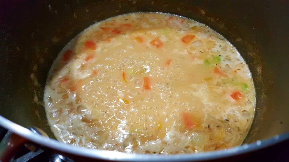 Cheddar Beer Soup cooking in a pan
