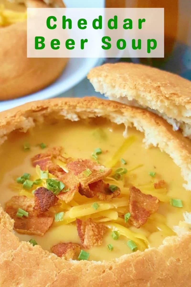 a bread bowl filled with Cheddar Beer Soup.
