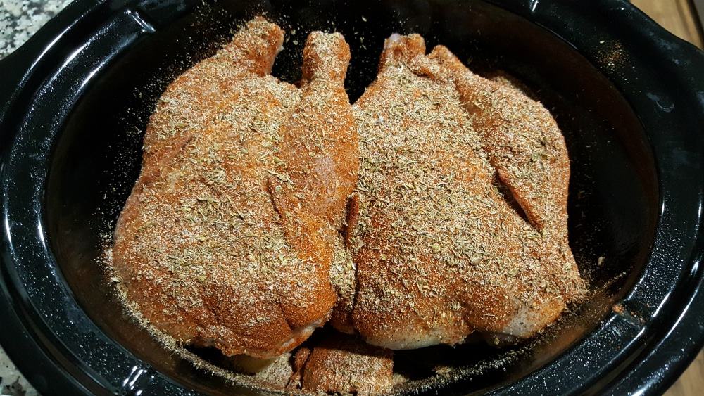 Crockpot Cornish Game Hens and Veggies Recipe - place hens in the crockpot and cover with herbs and spices