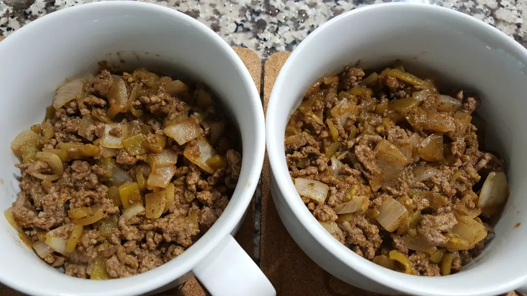 two round baking dishes filled with ground beef, garlic, green chiles, cumin, oregano, and chili powder