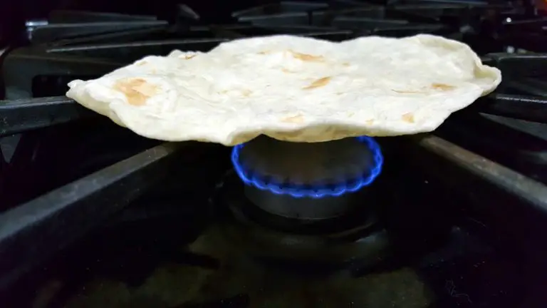 tortilla cooking over an open flame.