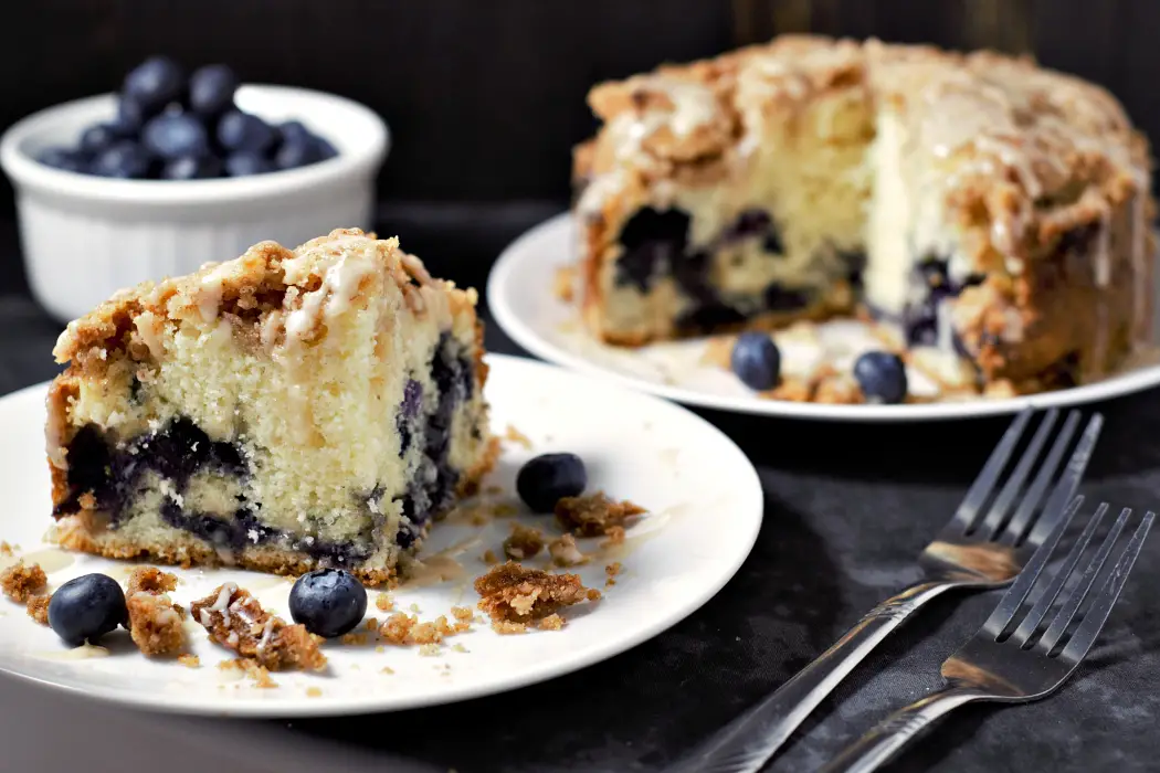 a slice of cake made with Blueberry Crumb Cake Recipe.