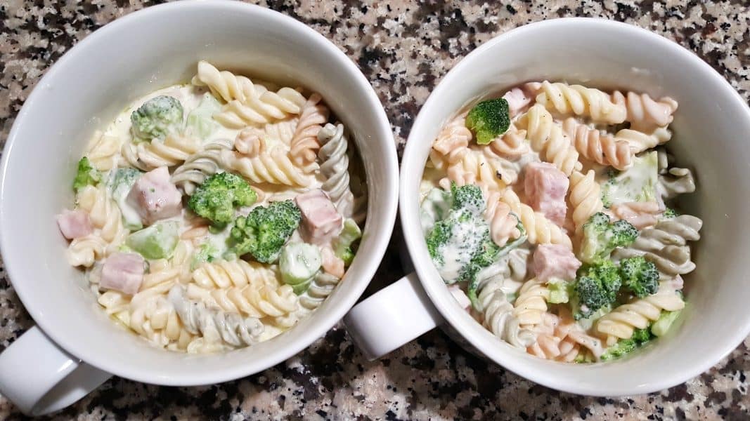 cheesy ham broccoli casserole poured into two oven safe bowls