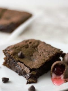 Chocolate Covered Cherry Cordial Brownies on a plate.