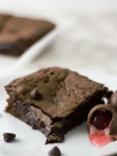 Chocolate Covered Cherry Cordial Brownies on a plate.