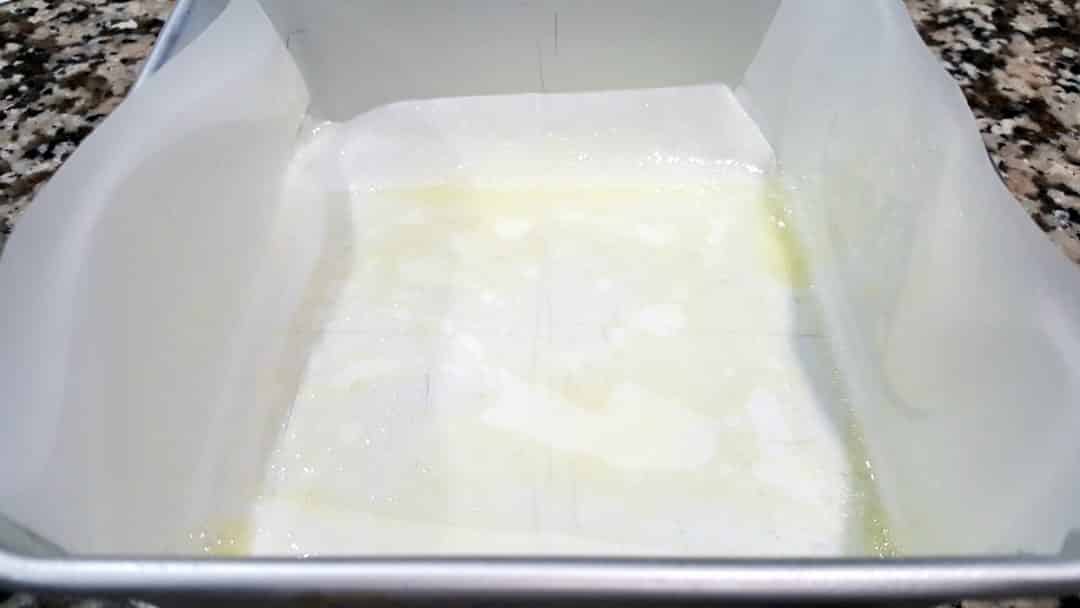 a 6 x 6 cake pan lined with parchment paper and sprayed with non-stick spray