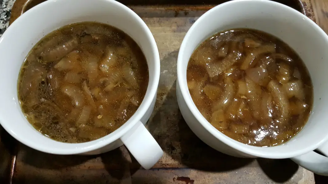 French onion soup in two soup bowls.