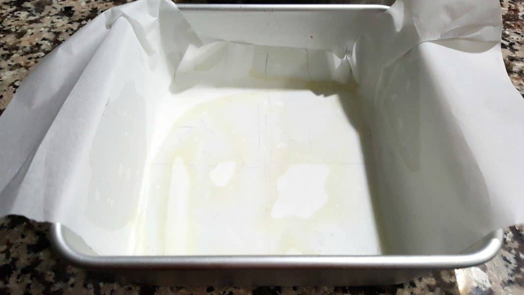 a parchment paper sling in a 6 x 6 inch cake pan