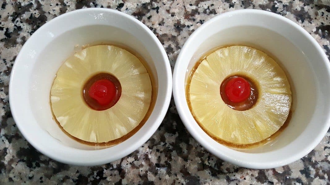 pineapple rings and cherries in two ramekins
