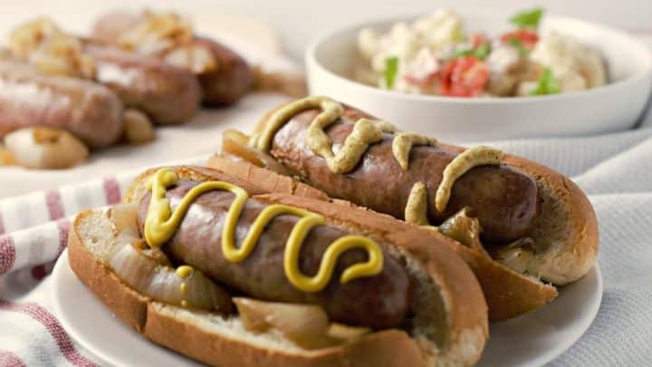 Beer Brats and Caramelized Onions with a side dish.