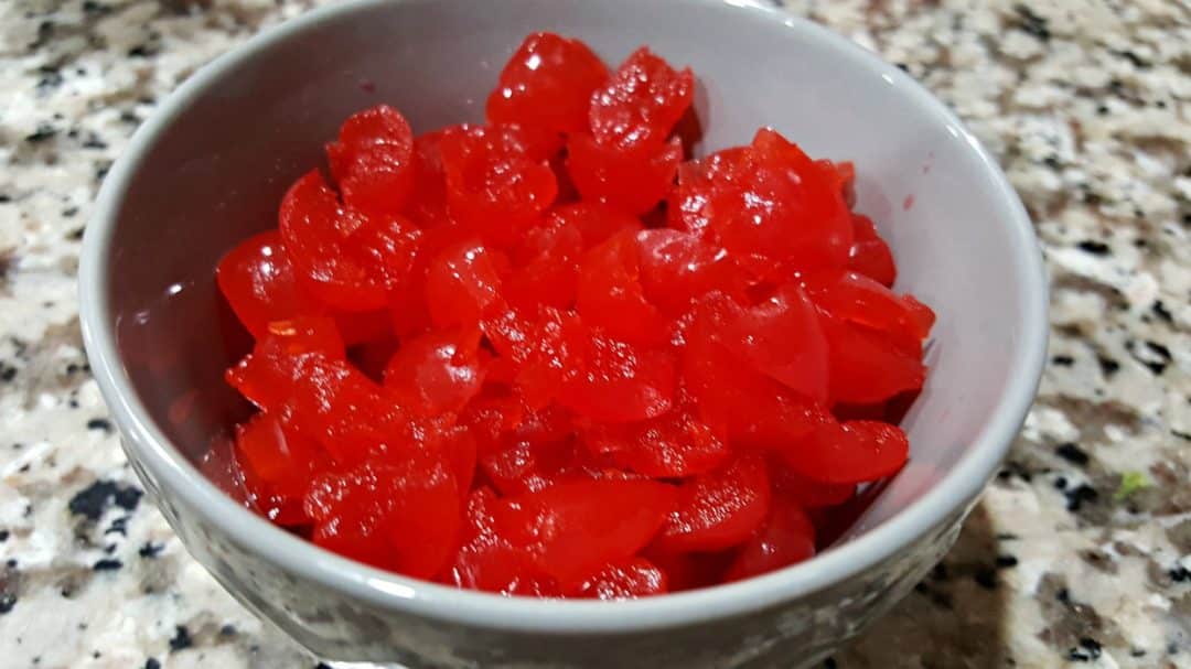 a bowl filled with chopped maraschino cherries.