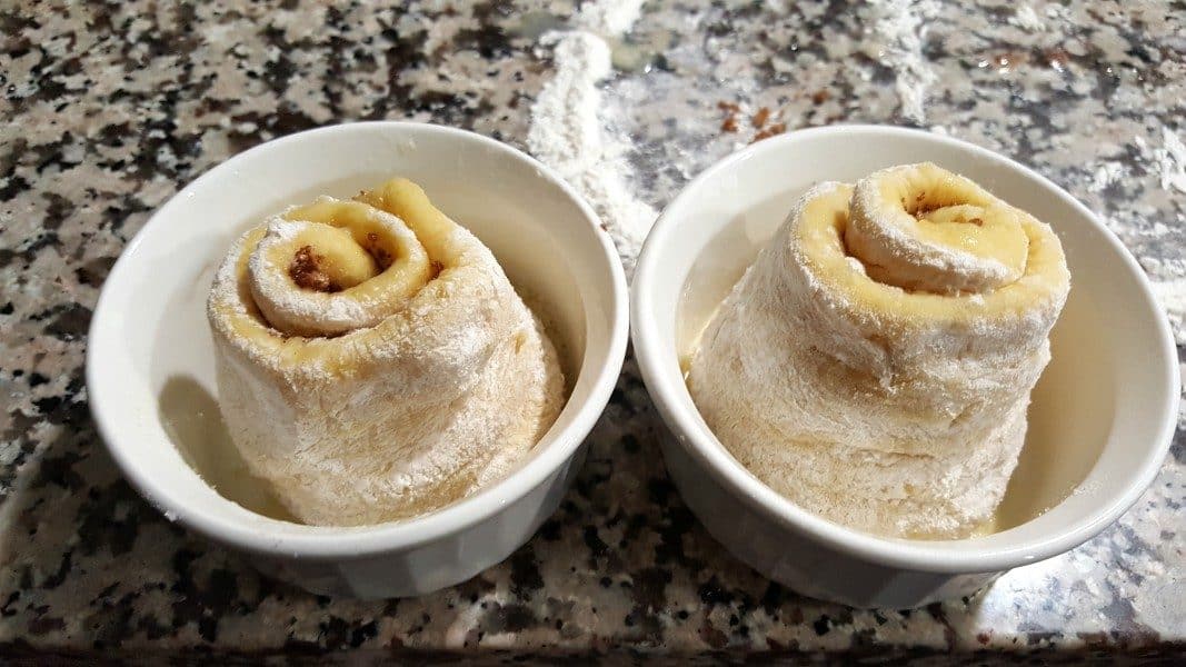 uncooked cinnamon rolls in two ramkeins