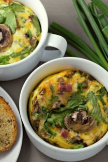 Baked Cheesy Ham Spinach Omelets in two casserole dishes.