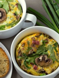 Baked Cheesy Ham Spinach Omelets in two casserole dishes.