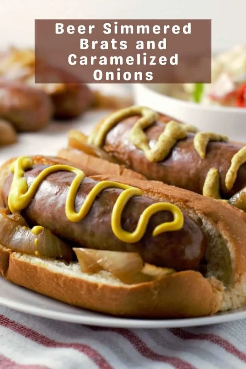 two Brats and Onions on a plate.