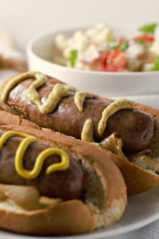 Beer Brats and Caramelized Onions on a plate.