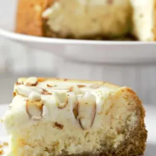 White Chocolate and Almond Amaretto Cheesecake on a plate.