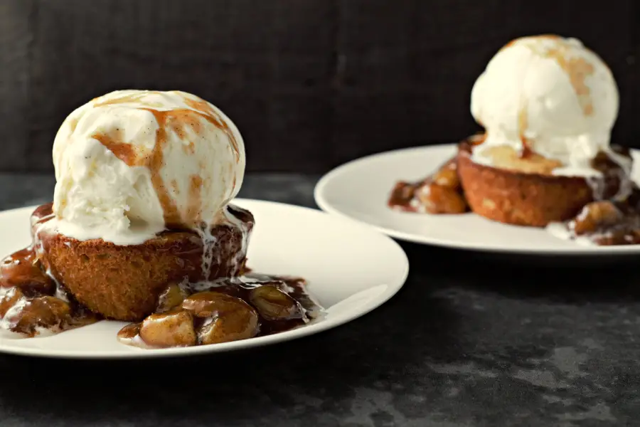 easy Caramelized Bananas on top of Peanut Butter Cookie Cups topped with Ice Cream on two plates.