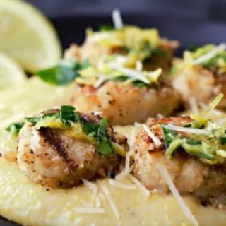 Grilled Parmesan Breaded Scallops and Cheesy Polenta on a plate.