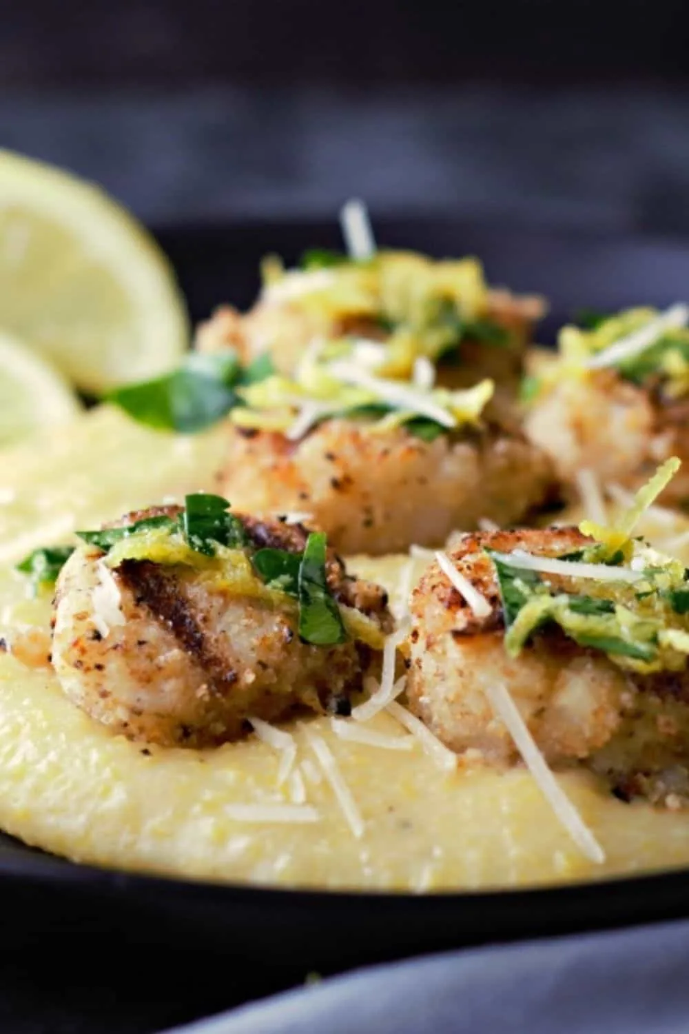 Grilled Parmesan Breaded Scallops and Cheesy Polenta on a plate.