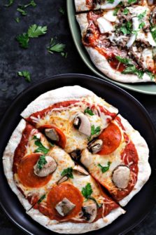 Grilled Pizza on two plates.