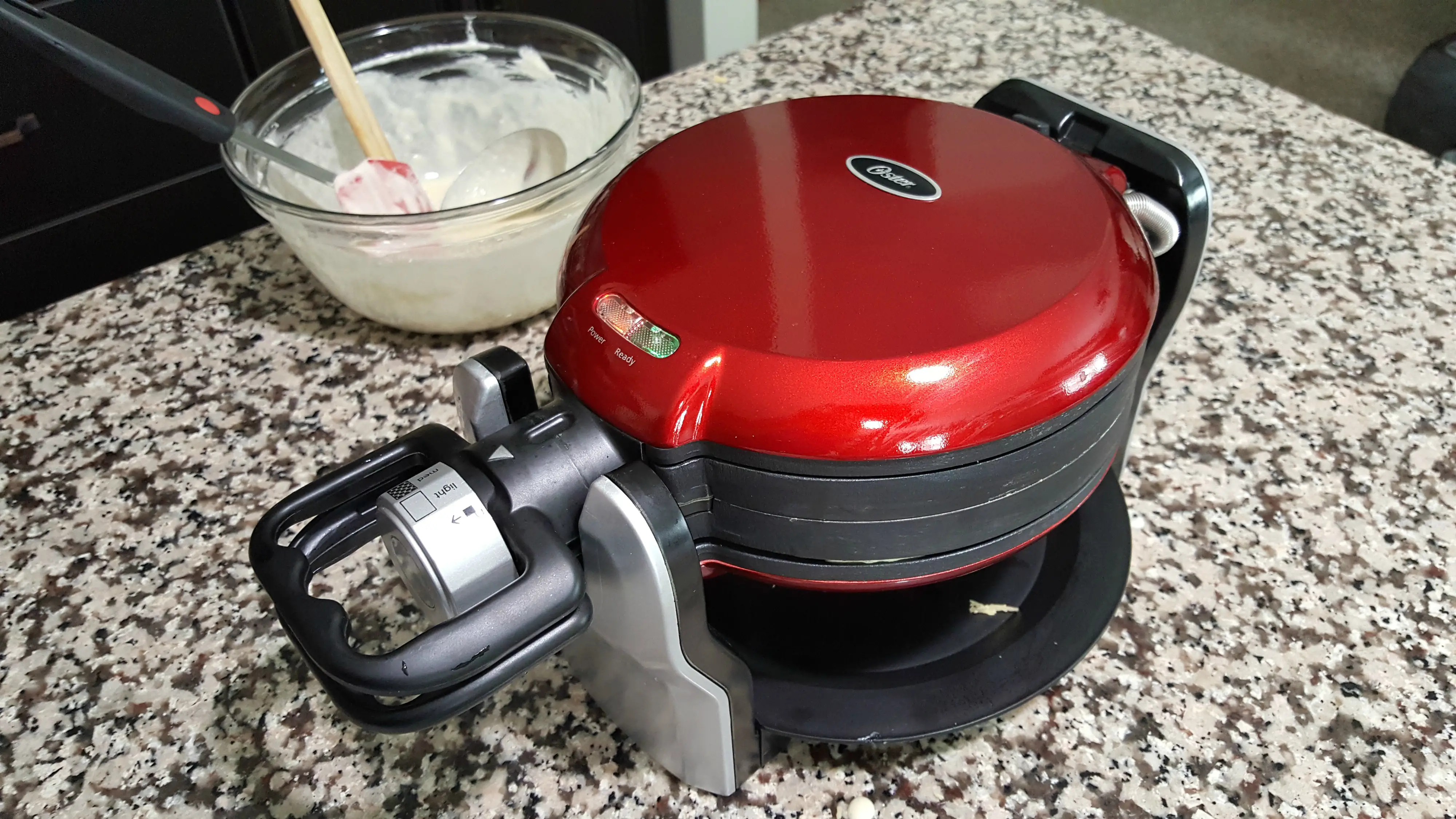 a double-sided waffle maker and waffle batter.