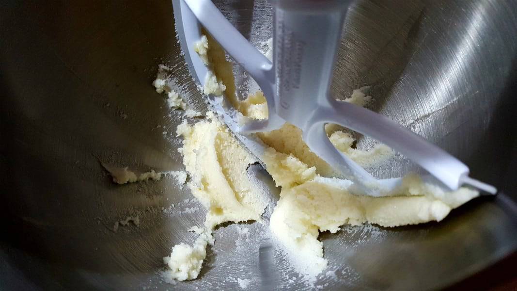 butter and sugar creamed together in kitchenaid mixing bowl with scraper paddle.