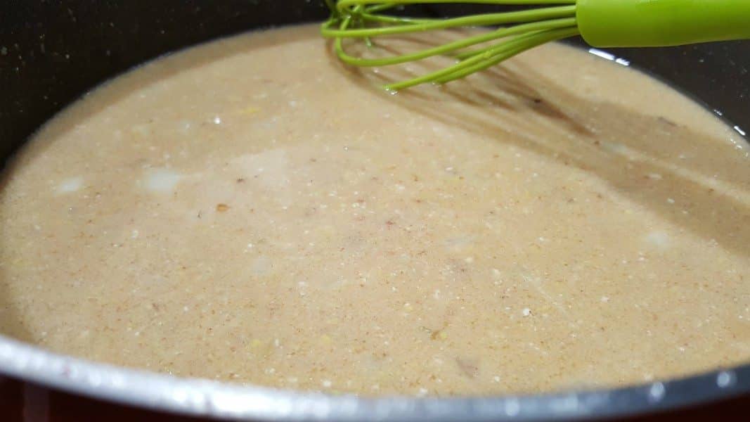 swedish meatball gravy cooking in a skillet