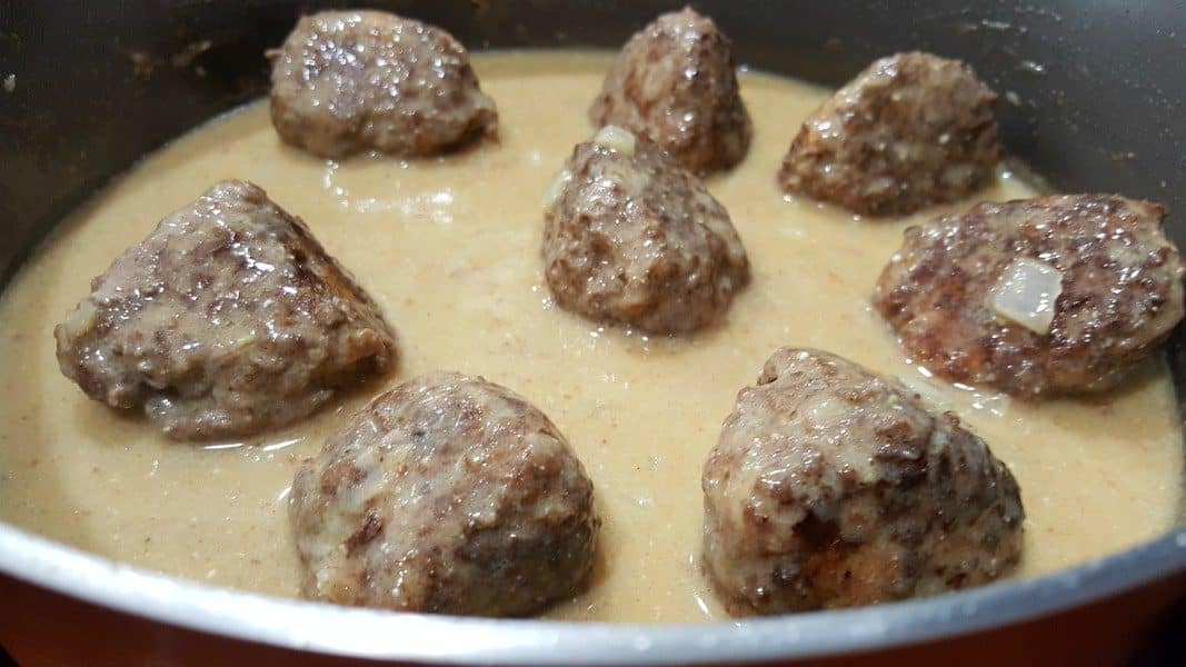 swedish meatballs cooking in gravy