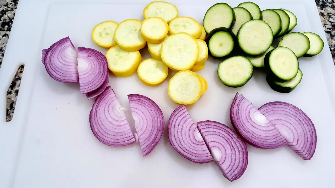 sliced zucchini, sliced yellow squash, and sliced red onions.