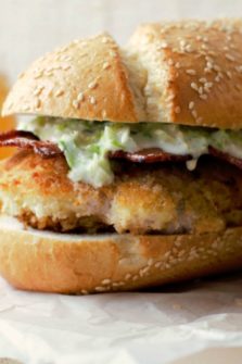 Fried Chicken Bacon Parmesan Sandwich on parchment paper.