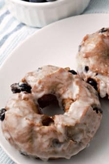 Glazed Blueberry Cake Donuts on a plate.