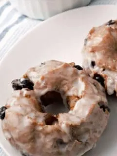 Glazed Blueberry Cake Donuts on a plate.