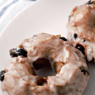 Glazed Blueberry Cake Donuts on a plate.